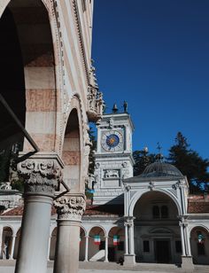 an old building with a clock tower in the middle