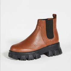 Leather: Patent Calfskin Contrast Elastic Gores Pull Tabs Round Toe Rubber Lug Sole Lined Imported, China This Item Cannot Be Gift-Boxed Style # Vroug30142 Heel: 1.75in / 45mm Platform: 1.25in / 30mm Bring A Bold Look To Your Bootie Collection With These Substantial Chelsea Boots From Villa Rouge, Which Updates A Classic And Versatile Silhouette With A Chunky Lug Sole And Two-Tone Design. Practically In Perfect Condition. Super Comfortable And Super Trendy! Combat Boot, Moto Boots, Lug Sole, Bootie, Chelsea Boots, Combat Boots, Calf Skin, Two Tone, Chelsea