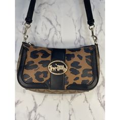 Coach Georgia Baguette With Leopard Print & Signature Canvas Detail Printed Coated Canvas, Smooth Leather And Signature Coated Canvas. Inside Multifunction Pocket. Zip Top Closure, Fabric Lining, Outside Open Pocket. Detachable Strap With 23 Drop For Shoulder Or Crossbody Wear. 9 ¾ L X 5 ¾ H X 2 ½ W Style# 5603, No Handle Or Coach Tag, Preloved. No. G2080-5608 Designer Brown Baguette Bag For Everyday, Brown Formal Baguette Bag, Formal Brown Baguette Bag, Designer Brown Baguette Bag, Brown Baguette Bag For Evening, Evening Brown Baguette Bag With Adjustable Strap, Brown Baguette Bag With Branded Hardware For Travel, Brown Baguette Bag With Detachable Strap, Brown Clutch Shoulder Bag With Branded Hardware