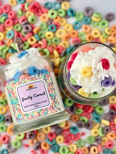 a jar filled with lots of colorful sprinkles next to a small glass container