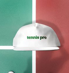 Tennis Pro Hat- (New) Cotton Unstructured 5 Panel Snapback in WhiteClosure - 7 Button Plastic SnapColor - NavyConstruction - 5 Panel SnapbackContents - 60% Cotton / 40% PolyesterProfile - 3.25"Size - One Size Fits All (6 ⅝” – 7 ⅝”)Structure - Lightly Structured- Flocked "Tennis Pro" Patch Tennis Birthday Party, Tennis Hat, Vintage Baseball Hats, Tennis Birthday, Retro Tennis, Huntington Park, Tennis Apparel, Dope Hats, Tennis Style