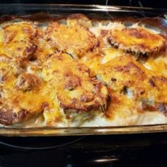 a casserole dish is sitting on the stove top, ready to be eaten