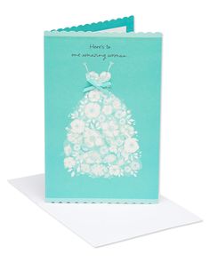 a blue card with white flowers on it