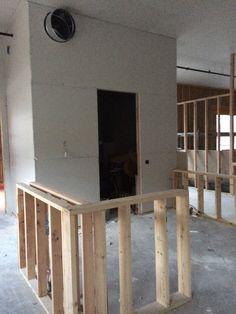 an unfinished room with wood framing around it