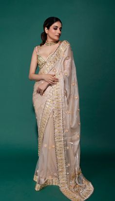 A delicate organza saree paired with a patchwork blouse embellished with gold metals, crystal stones, and pearls.Please note - the set doesn't include a stitched petticoat. Only petticoat fabric is provided. In case you would like to get a stitched petticoat with the set, you can connect with our personal stylist at 9967996897.From Papa Don’t Preach’s Bring Your Own Fairytale collection. DELIVERY TIMEPlease allow 8-12 weeks for your outfit to arrive. FABRIC DETAILSFluid Organza Professional clea Embellished Chanderi Pre-draped Saree, Elegant Pre-draped Kundan Saree For Party, Traditional Embellished Tissue Silk Pre-draped Saree, Transitional Organza Saree For Reception, Transitional Reception Organza Saree, Elegant Organza Pre-draped Saree With Mirror Work, Traditional Embellished Chanderi Pre-draped Saree, Fitted Organza Pre-draped Saree With Gota Work, Organza Saree With Mirror Work For Reception