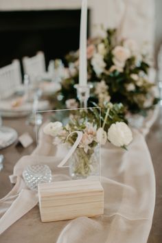 the table is set with flowers and candles