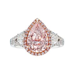 Pretty in Pink! This three-stone ring from Vihari Jewels features a 2.52 carat Very Light Pink Pear Shape Diamond (GIA Certificate #6197883836) surrounded by a pink diamond halo of 27 pink diamonds totaling 0.16 carats set in 18K Rose Gold. To finish the ring, the pink diamond has been set between 2 half moon shaped diamonds totaling 0.52 carats (F color, VS1 clarity). To complete this feminine beauty, the ring has been set in a 18K White Gold two band setting with 34 round white diamonds (F col Pink Pear Diamond Ring, Radiant Diamond Rings, Luxury Diamond Jewelry, Pear Shaped Diamond Ring, Very Light Pink, Pear Diamond Rings, Gia Certificate, Pink Diamond Ring, Expensive Jewelry Luxury