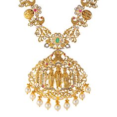 Virani Jewelers presents this stunning 22k gold and gemstone necklace, a timeless expression of beauty and grace. Crafted with precision and elegance, this long Indian gold necklace features a captivating array of emeralds, rubies, cubic zirconia, and pearls. The golden allure of 22k gold enhances the beauty of this gold temple necklace, creating a timeless piece of Indian gold jewelry that resonates with cultural heritage and refined taste. Features • 22k yellow gold • Ruby • Emerald • Cubic zi 22k Gold Temple Jewelry Emerald Necklace For Celebration, Yellow Gold Emerald Necklace For Festivals, Festive 22k Gold Emerald Necklace For Celebration, Festive Yellow Gold Emerald Necklace For Celebration, 22k Gold Necklace With Intricate Design For Reception, 22k Gold Necklaces With Intricate Design For Reception, Yellow Gold Gemstone Temple Necklace For Wedding, Yellow Gold Temple Jewelry Emerald Necklace For Wedding, Yellow Gold Emerald Necklace Temple Jewelry For Wedding