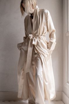 Drape yourself in opulence with the Brigitte Silk Robe. The ultimate luxury for chilly mornings or after a hot shower. 100% Silk Charmeuse Open-front robe with tie-waist Patch pockets Contrast piping 52" length (size small) Dry Clean Only All sale items are FINAL SALE. Elegant Spring Home Robe, Chic Silk Wrap Robe, Elegant Wrap Robe With Tie Waist, Elegant Cream Robe With Long Sleeves, Elegant Cream Long Sleeve Robe, Elegant Spring Robe With Tie Waist, Elegant Silk Robe For Loungewear, Chic Long Robe For Loungewear, Elegant Silk Robe With Tie Waist