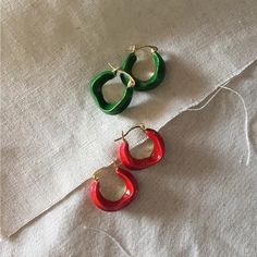 [MATERIAL]: Brass with enamel. [HOOP SIZE]: 20mm or 0.78" Trendy Red Nickel-free Hoop Earrings, Trendy Red Metal Hoop Earrings, Red Enamel Round Earrings, Red Round Enamel Earrings, Round Enamel Hoop Earrings As A Gift, Trendy Round Enamel Hoop Earrings, Trendy Small Hoop Red Earrings, Trendy Small Red Hoop Earrings, Trendy Red Hoop Earrings