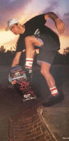 a man riding a skateboard up the side of a ramp at sunset or dawn