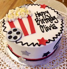 a birthday cake decorated with popcorn and stars