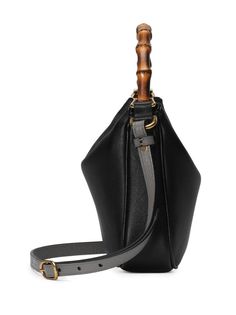 small Diana leather shoulder bag from Gucci featuring black, calf leather, gold-tone hardware, signature Double G logo, concealed magnetic fastening, two adjustable detachable shoulder straps, signature bamboo top handle, main compartment and internal zip-fastening pocket. This item is in size UNI and the color is Black Gucci Shoulder Bag With Bamboo Handle For Daily Use, Chic Gucci Shoulder Bag With Bamboo Handle, Gucci Top Handle Shoulder Bag With Bamboo Handle, Gucci Crossbody Shoulder Bag For Everyday Use, Evening Leather Shoulder Bag With Bamboo Handle, Leather Shoulder Bag With Bamboo Handle For Evening, Gucci Black Bag With Bamboo Handle, Gucci Leather Shoulder Bag With Leather Handles, Gucci Crossbody Shoulder Bag With Adjustable Strap