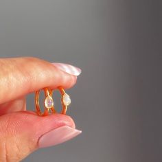 A pair of delicate Moonstone mini hoop earrings in 14k gold plated 925 sterling silver. These minimalist dainty earrings feature a small natural moonstone hoop.  Stack these gold moonstone earrings with -  Starburst opal hoop earrings: https://www.etsy.com/uk/listing/1341094262/genuine-opal-star-hoop-earrings-in-14k Moonstone gold necklace: https://www.etsy.com/uk/listing/1181311651/natural-moonstone-star-necklace-in-14k Moonstone gold ring: https://www.etsy.com/uk/listing/1096949725/genuine-moo Stackable Huggie Earrings Fine Jewelry For Gift, Stackable Huggie Earrings As Gift In Fine Jewelry, Dainty Huggie Earrings For Anniversary, Dainty Stackable Huggie Earrings For Anniversary, Dainty Teardrop Huggie Earrings, Dainty White 14k Gold Filled Huggie Earrings, Minimalist Sterling Silver Gemstone Huggie Earrings, Dainty Huggie Cartilage Earrings For Anniversary, Dainty Tarnish-resistant Huggie Rings