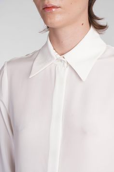 Keltie Shirt in beige silk, collar, long sleeves, hidden closure with buttons, buttons on the wrists, straight hem, semisheer, 100% silk, Made in Lithuania, Model is 180 cm and wears 36 Workwear Silk Blouse With Spread Collar, Silk Blouse With Spread Collar For Workwear, Timeless Silk Shirt For Office, Timeless Office Blouse With Lapel Collar, Timeless Formal Blouse With Lapel Collar, Timeless Formal Blouse With Spread Collar, Timeless Blouse With Fold Down Collar For Daywear, Elegant Silk Shirt For Daywear, Silk Business Blouse For Spring