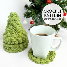 crochet coffee cup cozying set with mug and saucer in front of christmas tree