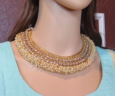 simple Bollywood gold necklace Indian Pakistani  Necklace wedding jewelry set with gold earrings women jewelry  brings hint of luxury to your outfits . This luxurious statement necklace set will add the touch of elegance to any outfit . Beautiful Necklace set are plated in GOLD plating for longer lasting. This gold necklace indian jewelry set looks beautiful  and elegant perfect for all occasion on any outfits you choose to wear ( wedding gowns, evening party dress, saree, salwar suits, lenga, etc.) *High quality craftsmanship 100% satisfaction guarantee  *Plated in Gold plating *polki stones and pearl Beads *base metal for necklace is copper *Adjustable necklace length *package include Necklace and  Jhumka Earrings *ready to ship from Houston TX United States GIFT- It comes in gift box pe Yellow Gold Costume Jewelry Necklace For Wedding, Gold Bridal Necklace With Elegant Design For Party, Wedding Gold Plated Pearl Necklace, Gold-plated Jewelry Sets For Receptions, Gold-plated Bridal Necklace For Reception, Gold Fashion Jewelry Bridal Necklace For Wedding, Gold Costume Jewelry Bridal Necklace For Wedding, Elegant Gold Plated Jewelry Sets For Reception, Gold Kundan Necklace With Elegant Design For Party