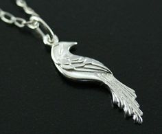 This unique pendant is made with sterling silver and represents a unique and beautiful motif of  bird inspired by the phoenix. It is a very original design drawn and made by the artist.  It is a one-of-a-kind jewel which will pass the test of time. A perfect present  for birthday(anniversary), Mother's Days, wedding, Christmas or to offer itself to oneself! dimensions : 2.7 cm x 0.7 cm matching earrings : https://www.etsy.com/ca/listing/219672188/silver-bird-earring-phenix-earring?ref=shop_home_active_40 matching bracelet : https://www.etsy.com/ca/listing/263440235/phoenix-bracelet-silver-phoenix-bracelet?ref=shop_home_active_23 Silver Bird Pendant Jewelry, Sterling Silver Bird Pendant Jewelry, Silver Bird Design Pendant Necklace, Elegant Sterling Silver Necklace With Bird Design, Silver Bird-shaped Sterling Silver Necklace, Sterling Silver Bird Necklace, Sterling Silver Necklace With Bird Design, Silver Sterling Silver Necklace With Bird Design, Unique Bird Design Pendant Jewelry