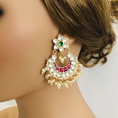 Beautiful and Unique Style Affordable Luxury traditional Bollywood Chandbali earrings with Kundan stones and Colored ruby semi precious Stones. 22k gold plated jewelry Length: 2.25 Inches Click here to see the complete collection of Kundan and Polki Statement Earrings at AryaFashions: https://www.etsy.com/shop/AryaFashions?section_id=25872820 Follow us on social media for new and latest designs: Facebook: www.facebook.com/shoparyafashions Pinterest: www.pinterest.com/aryafashions Instagram: www. Ceremonial Chandbali Earrings With Latkans, Ceremonial Bridal Chandbali Earrings For Diwali, Bollywood Style White Bridal Earrings With Gota Work, Traditional White Chandbalis With Gota Work, Bollywood Style Chandbalis For Ceremonial Occasions, Ceremonial Chandbali Bridal Earrings For Festivals, Multicolor Chandbalis With Zari Work For Wedding, Multicolor Zari Work Chandbalis For Wedding, Multicolor Cutdana Danglers For Wedding