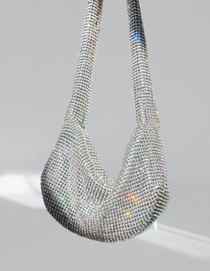 Get ready to dazzle with the Rhinestone Mini Shoulder Bag! This charming accessory features silver-tone accents and sparkling rhinestone embellishments, giving it a vintage feel. Available in silver, red, and green, it's the perfect choice for a fun night out. Equipped with a top zip and a sleek silver shoulder strap, this bag has plenty of space for all your essentials. It's got the perfect fit for your shoulder and ample sparkle from glass crystals. With dimensions of 12 inches in width, 7 inc Rhinestone Embellishments, Mini Shoulder Bag, Green Bag, Design Crafts, Fashion Forward, Night Out, Silver Tone, Shoulder Strap, Essence