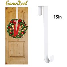 a door with a christmas wreath on it and a white handle for the front door