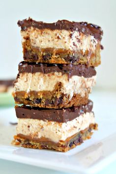 three pieces of chocolate and marshmallow ice cream dessert stacked on top of each other