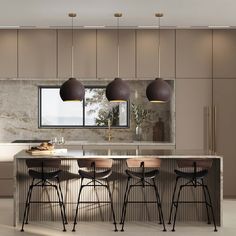 an island with stools and lights in a kitchen