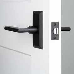 an open door with a black handle on it