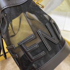 Mini Mon Tresor bucket bag made of black mesh and featuring Fendi lettering and a tone on tone leather trim.Lined and with gold-finish metalware.Two detachable shoulder straps, one long and one short, to wear the bag over the shoulder or cross-body.Made in Italy RODUCT INFORMATION Length:12, cm Height:18, cm Depth:10, cm Weight:0,275 kg Composition:100% Polyamide, 100% Calf leather Fendi Moonlight Bag, Fendi Bucket Bag Mon Tresor, On-the-go Crossbody Bucket Bag With Detachable Handle, Fendi Monster Bag, Fendi Monogram Bag, Black Mesh, Diaper Backpack, Casual Backpack, Fendi Bags