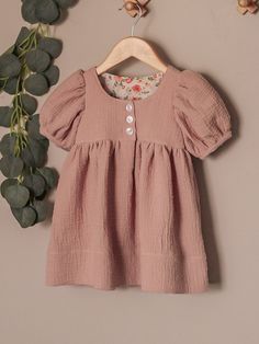 This Bonn Dress (2T) is made with eyelet double gauze. It has button front and balloon style short sleeves.  Because this is a handmade dress, the fit is different than store bought clothes. Please check the measurements below to make sure it fits correctly. Suitable for the body measurements: >Height- 35" >Chest- 20 1/2" >Waist- 21" >Hip- 21" Finished Dress Length-18 7/8" ✿ For custom made/"made to order" orders, please feel free to message me! ✿ Fabrics: Main-Eyelet Double Gauze, Lining-100% C Cotton Puff Sleeve Playtime Dresses, Cotton Puff Sleeve Dresses For Playtime, Cotton Puff Sleeve Dress With Button Closure, Cute Short Sleeve Dress With Button Closure, Cute Pink Cotton Puff Sleeve Dress, Double Gaze, Handmade Dress, Double Gauze, Handmade Dresses