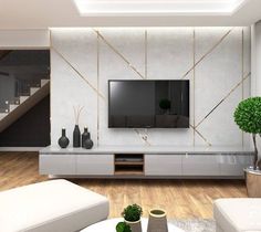 a living room with white furniture and a flat screen tv mounted to the side of a wall