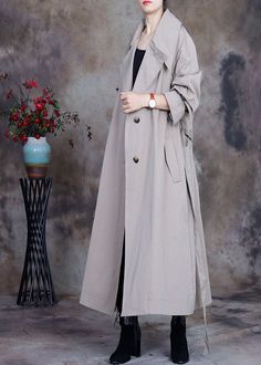 Plus Size Grey tie waist button Peter Pan Collar Trench coats SpringFabric: Cotton BlendedSize & Fit: Fit: This garment fits true to size.Length: Size 4XL measures 44.07"from shoulder to hemBust: Great for any cup size. Waist: Loose Fit. Comfortable room throughout midsection.Hip: Loose Fit - room for hips. Hand Wash Cold. Spring Oversized Solid Color Outerwear, Oversized Solid Color Spring Outerwear, Oversized Solid Color Outerwear For Spring, Casual Long Belted Outerwear, Oversized Long Belted Outerwear, Long Spring Outerwear With Button Closure, Spring Oversized Double-breasted Outerwear, Oversized Double-breasted Spring Outerwear, Grey Tie