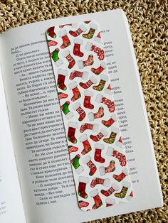 an open book with christmas stockings and socks on it