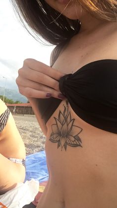 a woman with a tattoo on her stomach