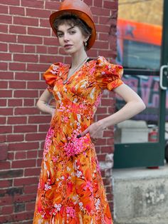 "Extreme Bight Mood Puff Sleeve 70s Hawaiian Print Orange and Pink Spring Maxi Dress. Here comes the sun. In excellent condition with no flaws of note. No tags. Feels synthetic. Back vinyl zip with hook and eye at neck. So beautiful Bust 31\" Waist 24\" Hip 36\" Length 49\" Please message me with questions before purchasing. All sales are final and ship fast from the Vermont shop. Find us on Instagram @anasclosetfullofcolor Thankyou! More vintage dresses here: https://www.etsy.com/shop/anastasia Retro Summer Maxi Dress With Vintage Print, Retro Vintage Print Maxi Dress For Summer, Retro Short Sleeve Maxi Dress For Beach, Retro Maxi Dress With Vintage Print For Summer, Retro Short Sleeve Maxi Dress For The Beach, Retro Maxi Dress For Beach, Vintage A-line Dress For Vacation, Vintage A-line Vacation Dresses, Vintage Summer Dresses With Vibrant Print