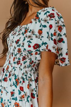 This lightweight flowy floral dress is an instant favorite to twirl our way from season to season. The perfect cross between boho and classic. A subtle square neckline, stretchy smocked bodice, and flutter shoulder sleeve are reason enough to fall in love. Flowy Smocked Dress With Ditsy Floral Print For Summer, Summer Floral Print Smocked Dress With Square Neck, Floral Print Smocked Dress With Square Neck For Summer, Flowy Smocked Dress With Flutter Sleeves For Garden Party, Flowy Smocked Dress With Square Neck For Garden Party, Summer Smocked Dress With Floral Print And Square Neck, Flowy Smocked Dress With Ditsy Floral Print For Vacation, Square Neck Smocked Dress With Floral Print For Brunch, Casual Smocked Dress With Floral Print And Flutter Sleeves