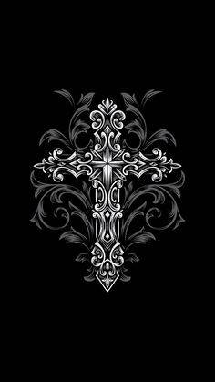 a black and white cross with swirls on the side, in an ornate pattern