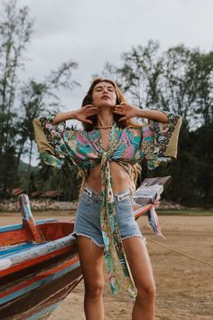 Our beautiful Metella Boho Kimono has a bold and vibrant floral with peacocks print design. Made from a lightweight cotton blend that will look great both as a summer layer or on the beach. Tropical V-neck Top For Summer, Tropical V-neck Top With Vibrant Print, Beachwear V-neck Tops With Tropical Print, Bohemian Tops For Vacation And Beach Season, Bohemian Tops For Beach Season Vacation, Summer Hippie V-neck Top, Patterned Hawaiian Tops For Summer, Hawaiian Patterned Tops For Spring, Patterned Hawaiian Tops For Spring