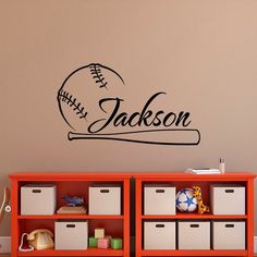 a baseball wall decal with the name jackson in black on an orange bookcase