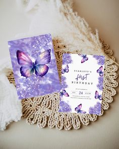 a purple and white birthday card with butterflies on it, next to a lace doily