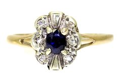 Vintage sapphire and diamond cluster 9ct yellow gold ring. Sapphire - the birthstone of September. Diamond - the birthstone of April. Fully hallmarked for 9ct gold assayed in London in 1982. In good vintage condition. This will arrive in a ring box. A lovely ring! Weight 1.81g. Size K, US size 5 1/4. The head measures 9.9mm by 8.3mm. Sapphire measures 4mm by 3.3mm. Ring Saphir, Ring Sapphire, Vintage Sapphire, Pearl Cluster, Green Diamond, Lovely Ring, Yellow Gold Pendants, Elegant Ring, Yellow Gold Ring