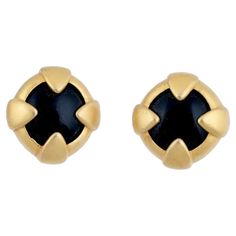 A vintage gold-tone metal clip-on earrings by Givenchy. Ca. 1980s. Round shape, central black stone cabochon. Marked Givenchy Paris New York on the backside. Collectible Luxury Costume Jewelry And Lapel Accessories. Dimensions: 5/8 x 5/8 in. All measurements are approximate. Condition Overall good vintage condition. Signs of wear and age. Has some stains and scuffs. Small dents and slight discoloration. Refer to photos. Vintage Givenchy, Givenchy Paris, Cabochons Stones, New Paris, Clip Earrings, Black Stone, Gold Tone Metal, Vintage Gold, Round Shape