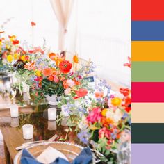 the table is set with colorful flowers and candles