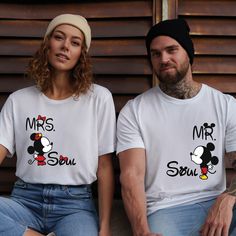 "Mr & Mrs ,Mickey and Minnie Shirt, Funny Partner Shirt, Couple T shirt, Valentines Day Shirt, Valentines Day Gift, Valentines Day FREE SHIPPING FOR ORDER $35 OR MORE WE USE FREE PRIORITY SHIPPING FOR 4 OR MORE SHIRTS ---How To Order --- 1-) Please, check and review all photos 2-) Choose your t-shirt size and color 3-) Write your design color in personalization box 4-) Click add to cart. You can go back to add more product 5-)Click \"Proceed to check out\" 6-)When you check out, you can add a note to seller for any request SIZE AND COLORS: For sizing details and color options, please see the listing images. PROCESSING TIME: The standard processing time is 1-3 business days. (We usually process and ship out the orders within 2 business days.) SHIPPING TIME: USA Orders: Standard - takes 3 to Family Matching Mickey Mouse Crew Neck T-shirt, Family Matching Mickey Mouse Cotton Tops, White Family Matching T-shirt With Mickey Mouse, Cute White Mickey Mouse Shirt, White Mickey Mouse Crew Neck Shirt, Mickey Und Minnie, Valentines Couple, Minnie Shirt, Gift Valentines Day