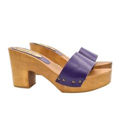 As versatile as they are cool, clogs in their minimal simplicity conquer everyone's most sophisticated and sought-after wardrobes. Clogs can wonderfully complete any kind of outfit and are the right compromise between comfort and elegance. Brown wooden base clogs Purple leather band Heel height 9 cm and plateau 3 cm Stable and comfortable made entirely in ITALY. Craftsmanship. BEFORE COMPLETING YOUR PURCHASE DO NOT FORGET TO CHECK THE SIZE! Length along the curve: 37 EU = 6 US = UK 5 = 24.50 CM Modern Clogs With Wooden Open Heel, Purple Slip-on Clogs For Summer, Modern Open Heel Clogs With Wooden Heel, Purple Closed Toe Clogs For Summer, Summer Purple Closed Toe Clogs, Modern Summer Clogs With Reinforced Heel, Purple Leather Slip-on Sandals, Purple High Heel Shoes With Leather Sole, Purple Open Heel Heels With Removable Insole