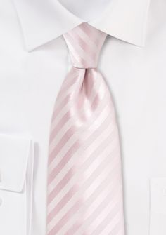 Elevate your style with the Blush Narrow Striped Necktie, a sophisticated accessory that adds a touch of charm to any ensemble. Whether you're shopping for men's suits or preparing for a special occasion, this necktie is a must-have. The delicate blush color exudes elegance and refinement, while the narrow striped pattern adds a hint of texture and interest. It pairs beautifully with a variety of suit colors, from navy to charcoal, allowing you to create a polished and put-together look. Make a Suit Colors, Men's Suits, Blush Color, Pink Stripes, Necktie, Stripes Pattern, Mens Suits, Neck Tie, Must Haves