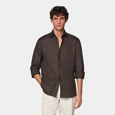 This breezy dark brown button-up shirt is tailored slim with soft collar interlining, a sleek French placket, and a slightly curved hem that makes it perfect for casually wearing untucked. Brown Slim Fit Button-up Shirt, Brown Shirt With Button Closure For Business Casual, Brown Shirt With Button Cuffs For Work, Brown Relaxed Fit Shirt For Work, Brown Button-up Shirt With Button Cuffs, Formal Brown Tops With Button Cuffs, Formal Brown Top With Button Cuffs, Brown Formal Top With Button Cuffs, Classic Brown Formal Tops