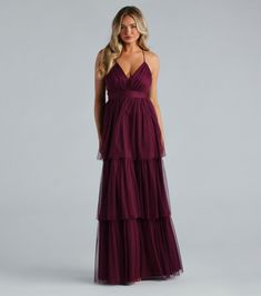 Look sophisticated and dreamy in the Joselyn formal long dress as a bridesmaid or attending a dance! She features adjustable spaghetti straps, a flattering V-neckline, and a delicate crisscross back. The tiered, ruffled A-line silhouette gives a subtly voluminous look, while the floor-length mesh fabric adds a touch of opulence. Complete the look with a statement ring set and heels.Fit & FeaturesSleeveless V-neckline, adjustable spaghetti strapsCrisscross, back zipper and hook-eye closureTiered ruffled A-line silhouetteFloor-length hemMesh fabric, stretchy knit liningPasties recommendedRuns true to size Maroon Tulle Dress, Egypt Wedding, Mauve Bridesmaid Dresses, Formal Long Dress, Plum Bridesmaid Dresses, Red Bridesmaid, Sequin Dress Party, Look Sophisticated, Prom 2024