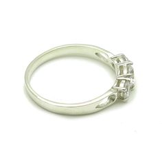 Sterling silver ring with 3 CZ - R000182. Stamped 925. Approximate weight 2.1 grams. Top width 0.5cm (0.20 inches). All our jewels are made from solid sterling silver 925/1000 and are carefully crafted by hand in our family workshop. We dispatch your orders in 5 working days, worldwide and the postage is $5. We ship registered priority mail. Please allow 5-7 working days for delivery in Europe and 10-15 working days outside Europe. For any questions - please do not hesitate to contact me! Elegant Sterling Silver Three Stone Stackable Rings, Classic Three Stone Stackable Promise Rings, Classic Three-stone Stackable Promise Rings, Formal Three Stone Crystal Ring, Formal Silver Three Stone Diamond Ring, Classic Hallmarked Cubic Zirconia Ring, Classic White Gold Crystal Ring Hallmarked, Classic White Gold Topaz Ring With Three Stones, Classic White Gold Three Stone Topaz Ring