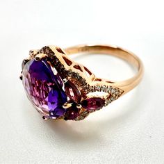 New Diamond And Amethyst Rhodolite Ring 14 K Pink Gold Comes With Certificate Bought This At A Closing Down Sale Of Saks To Then Sell On So It’s Brand New. Approx. Diamond Weight: 0.21 Color/Clarity: H-I / I1-I2 Approx. Gem Weight: 4.85 Size 6.5 Us Luxury Purple Gemstones With Halo Setting, Luxury Amethyst Gemstones With Accent Stones, Luxury Multi-stone Purple Jewelry, Luxury Purple Multi-stone Rings, Luxury Purple Multi-stone Jewelry, Luxury Amethyst Rings With Gemstone Accents, Exquisite Amethyst Ring With Gemstone Accents For Formal Occasions, Exquisite Purple Amethyst Ring With Gemstone Accents, Luxury Purple Jewelry With Center Stone